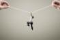 survival-man hangs from rope.jpg
