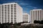 GlenStar, Walton Buy 40%-Vacant Towers for $58M